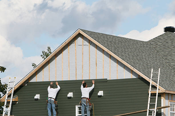 Professional Siding Installation technician working in Wellington, CO